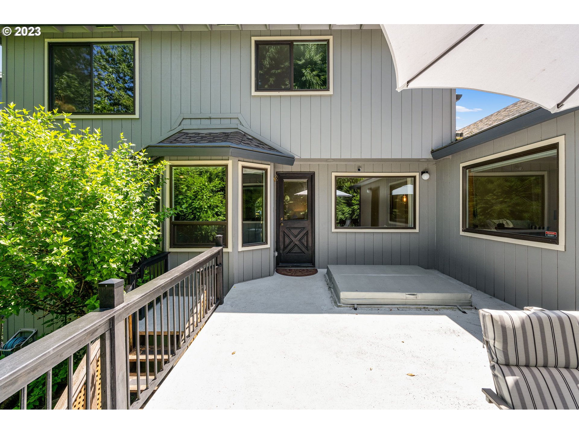 9062 Southwest Hill Street Portland, OR 97223 - Photo 38 of 48 a view of a house with porch and wooden floor