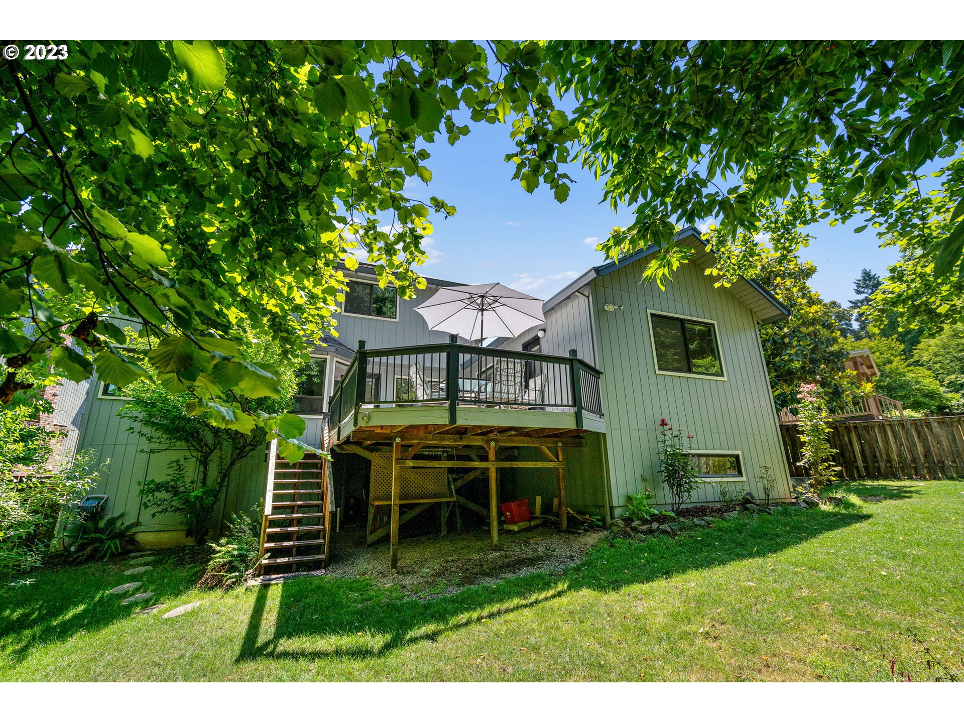 9062 Southwest Hill Street Portland, OR 97223 - Photo 41 of 48 a view of a house with backyard