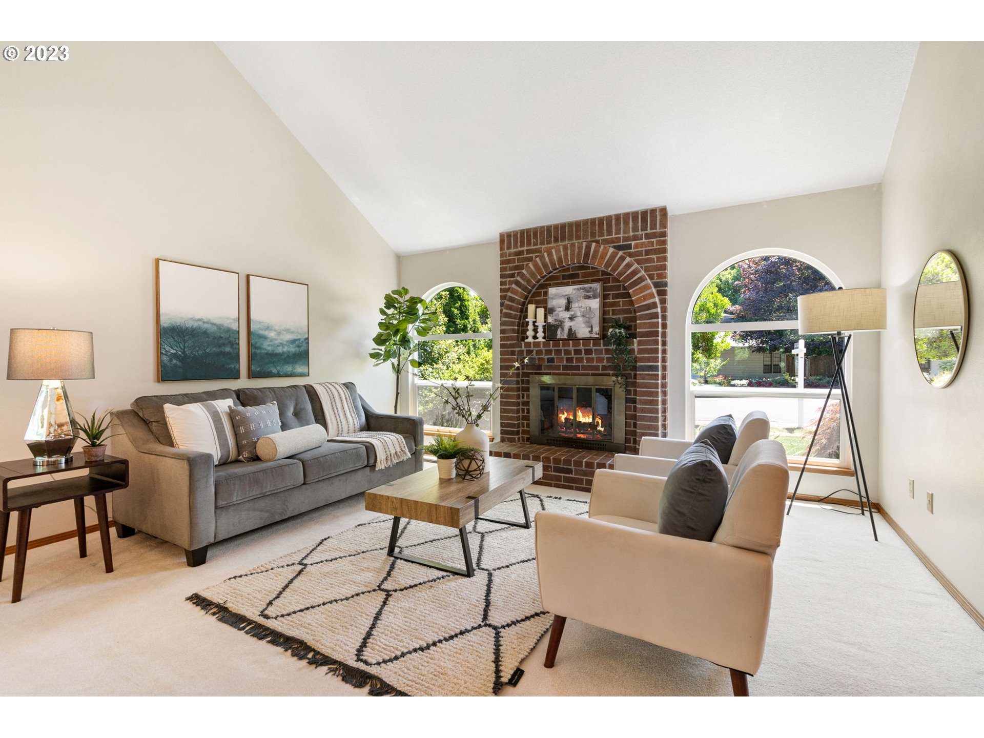 9062 Southwest Hill Street Portland, OR 97223 - Photo 5 of 48 a living room with furniture a fireplace and a large window