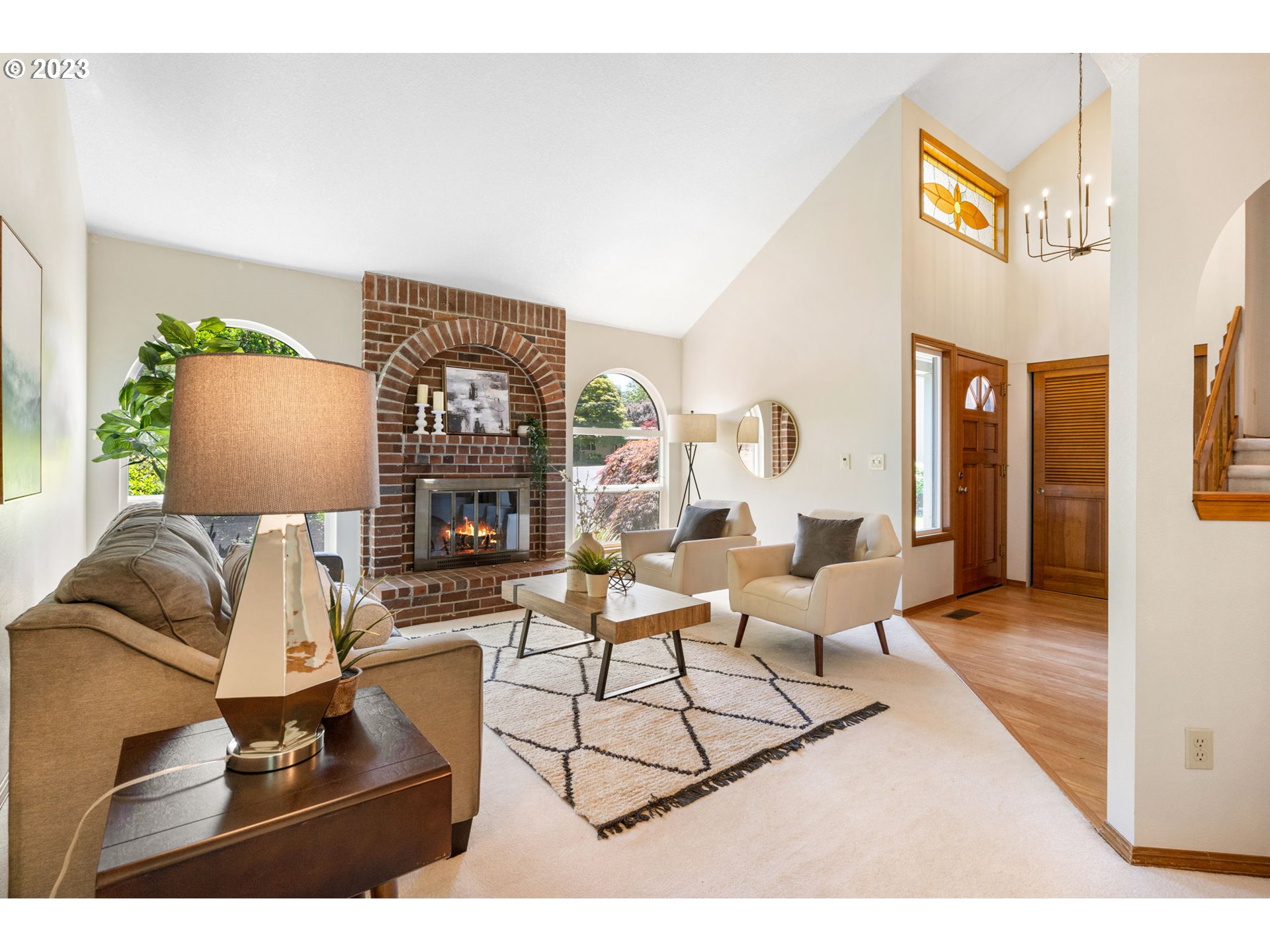 9062 Southwest Hill Street Portland, OR 97223 - Photo 6 of 48 a living room with furniture and a fireplace