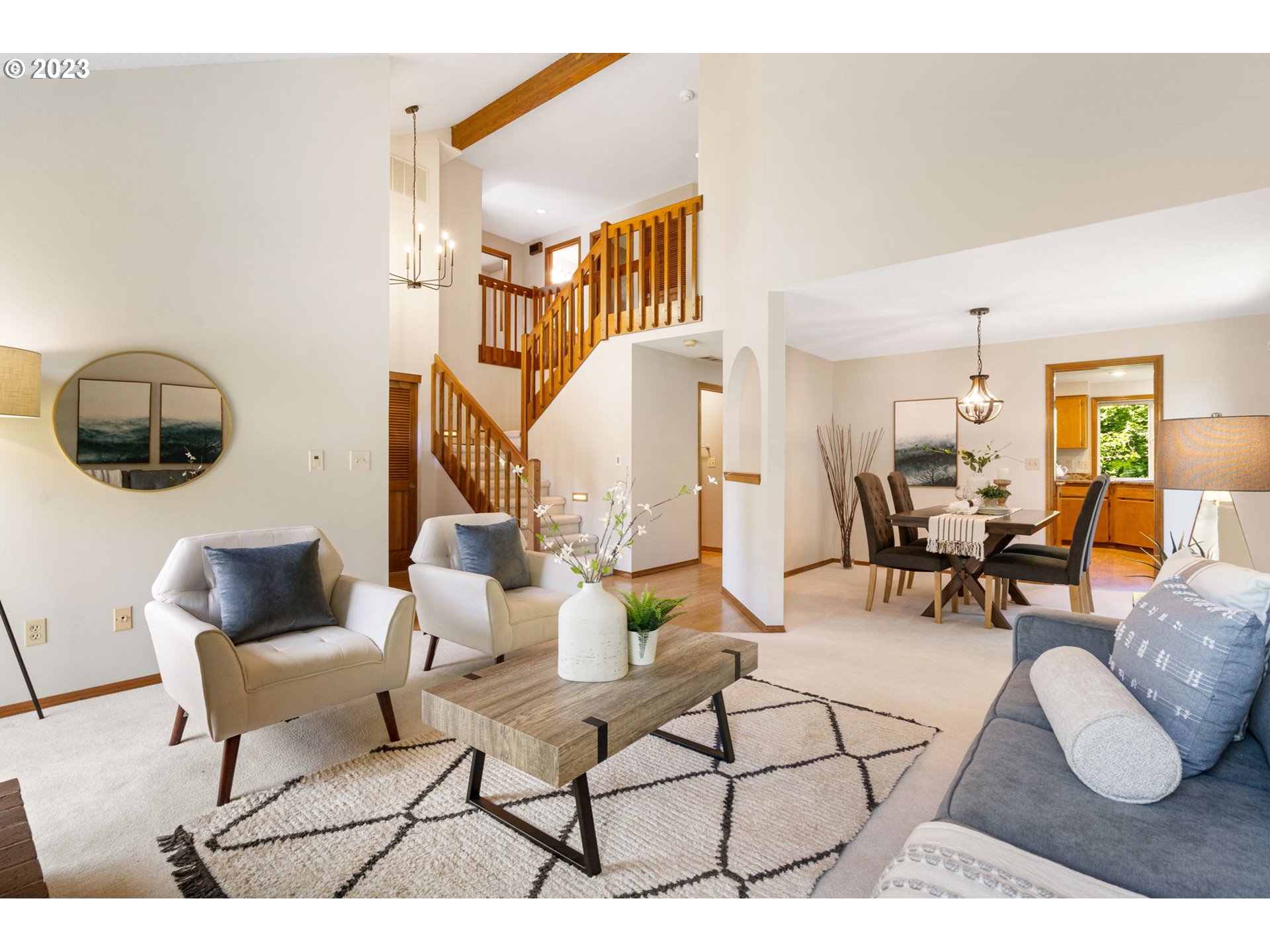9062 Southwest Hill Street Portland, OR 97223 - Photo 7 of 48 a living room with furniture and a mirror