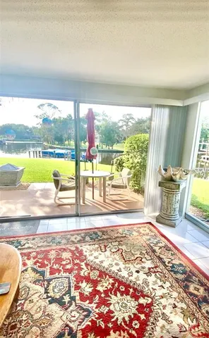 a view of a living room and kitchen