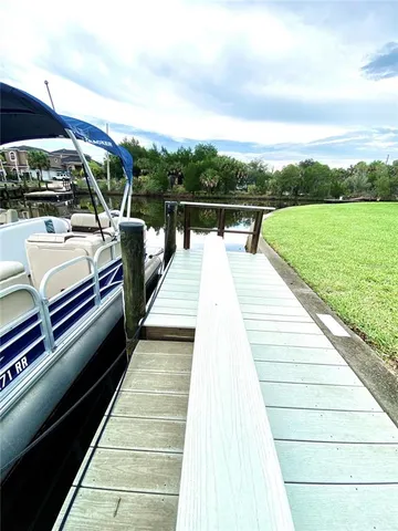 a view of balcony with two chairs and wooden floor