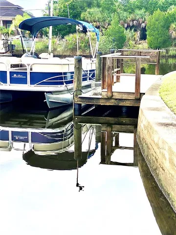 a view of swimming pool with outdoor seating