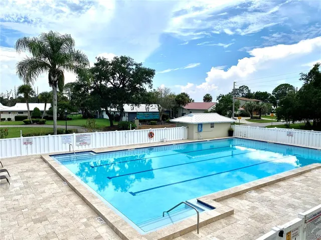 a view of swimming pool with a lounge chair