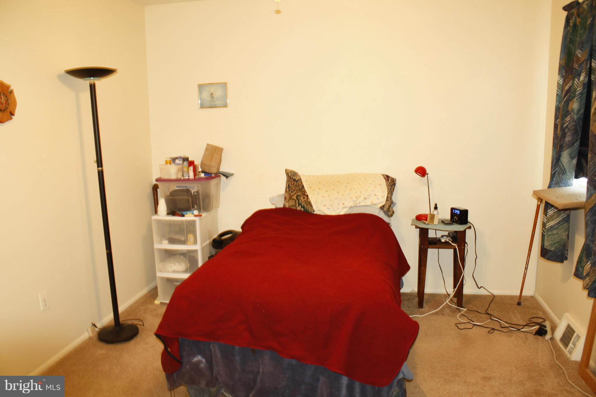 231 Highfalcon Road Reisterstown, MD 21136 - Photo 8 of 30 a bed sitting in a room next to a window