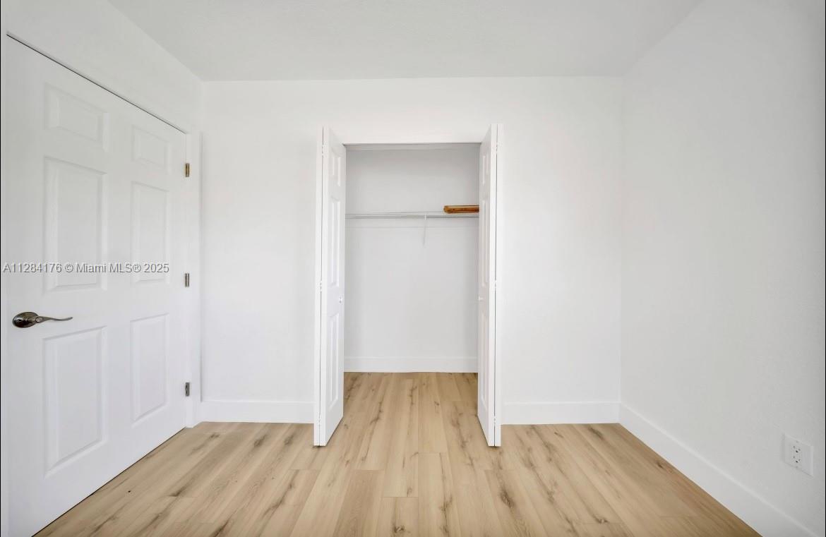 782 East 37th Street Hialeah, FL 33013 - Photo 12 of 46 wooden floor in a empty room