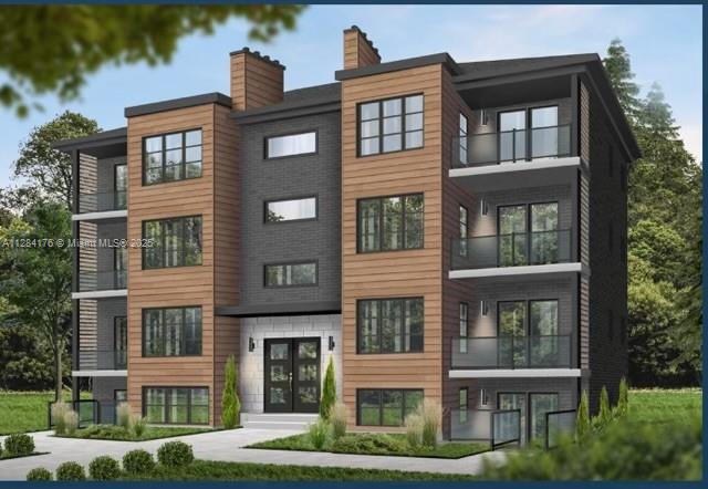 782 East 37th Street Hialeah, FL 33013 - Photo 23 of 46 a front view of a residential apartment building with a yard