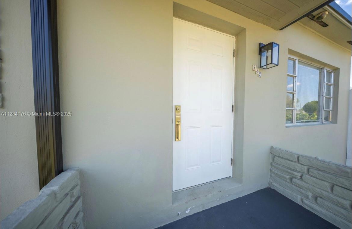 782 East 37th Street Hialeah, FL 33013 - Photo 3 of 46 a view of an entryway with a window