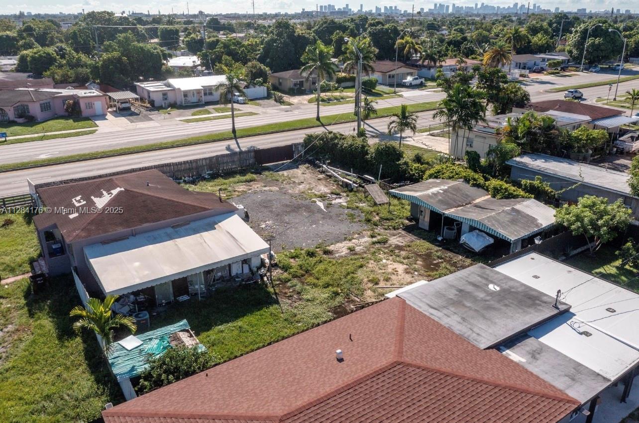 782 East 37th Street Hialeah, FL 33013 - Photo 33 of 46 an aerial view of a house with a garden and lake view