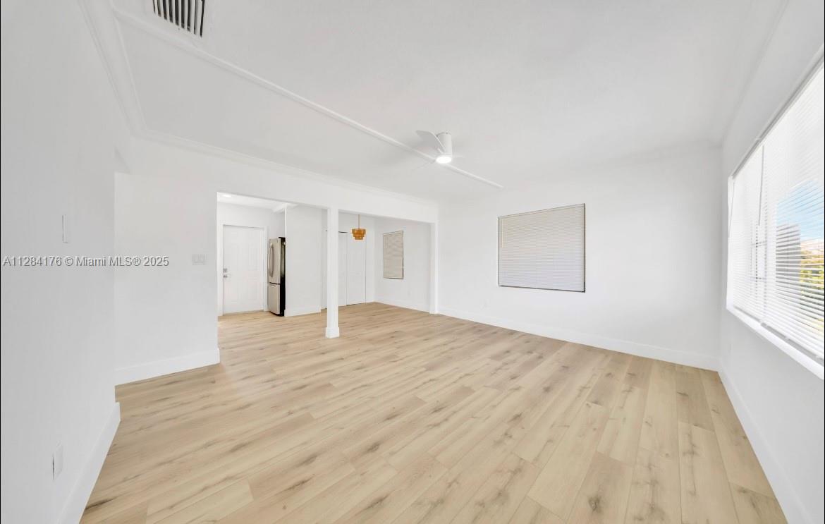 782 East 37th Street Hialeah, FL 33013 - Photo 9 of 46 a view of empty room with wooden floor and fan