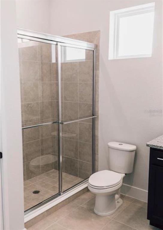 6824 Bridgman Street Orlando, FL 32827 - Photo 12 of 19 a bathroom with a toilet and a shower