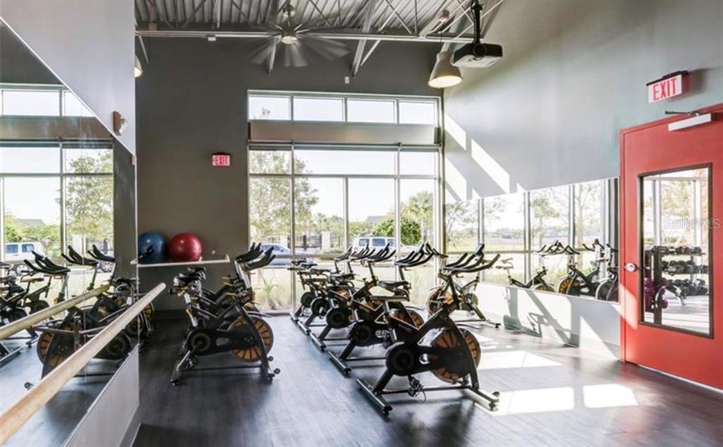 6824 Bridgman Street Orlando, FL 32827 - Photo 17 of 19 a view of a room with gym equipment