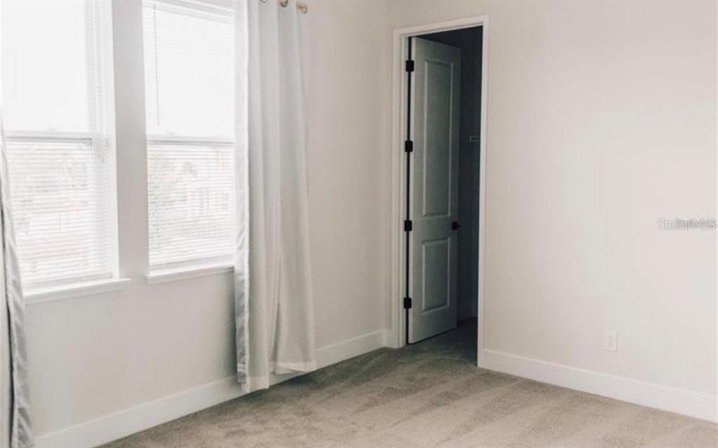 6824 Bridgman Street Orlando, FL 32827 - Photo 10 of 19 a view of an empty room with a window