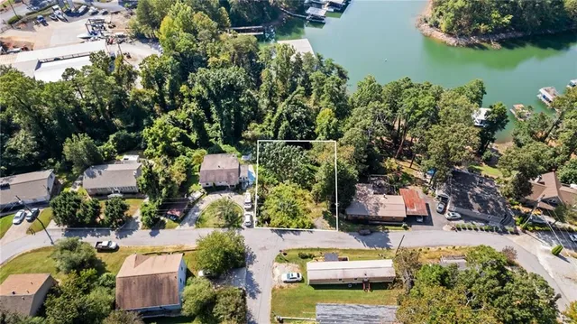 an aerial view of a house with a lake view