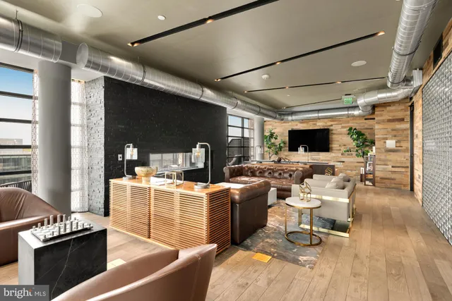 a living room with fireplace furniture and a flat screen tv