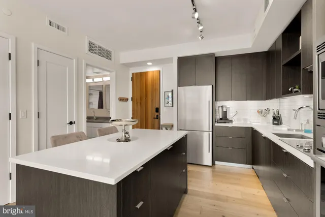 a kitchen with a sink a stove and refrigerator