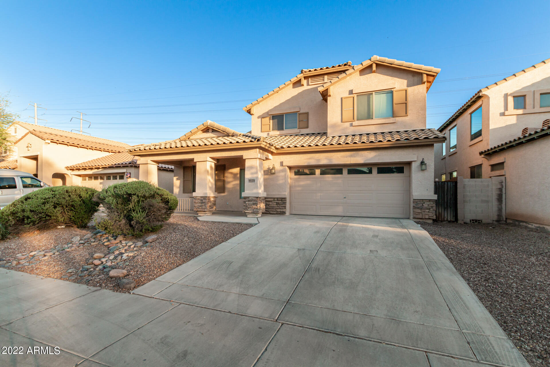 9123 West Heber Road Tolleson, AZ 85353 - Photo 1 of 41 a front view of a house with garage and parking