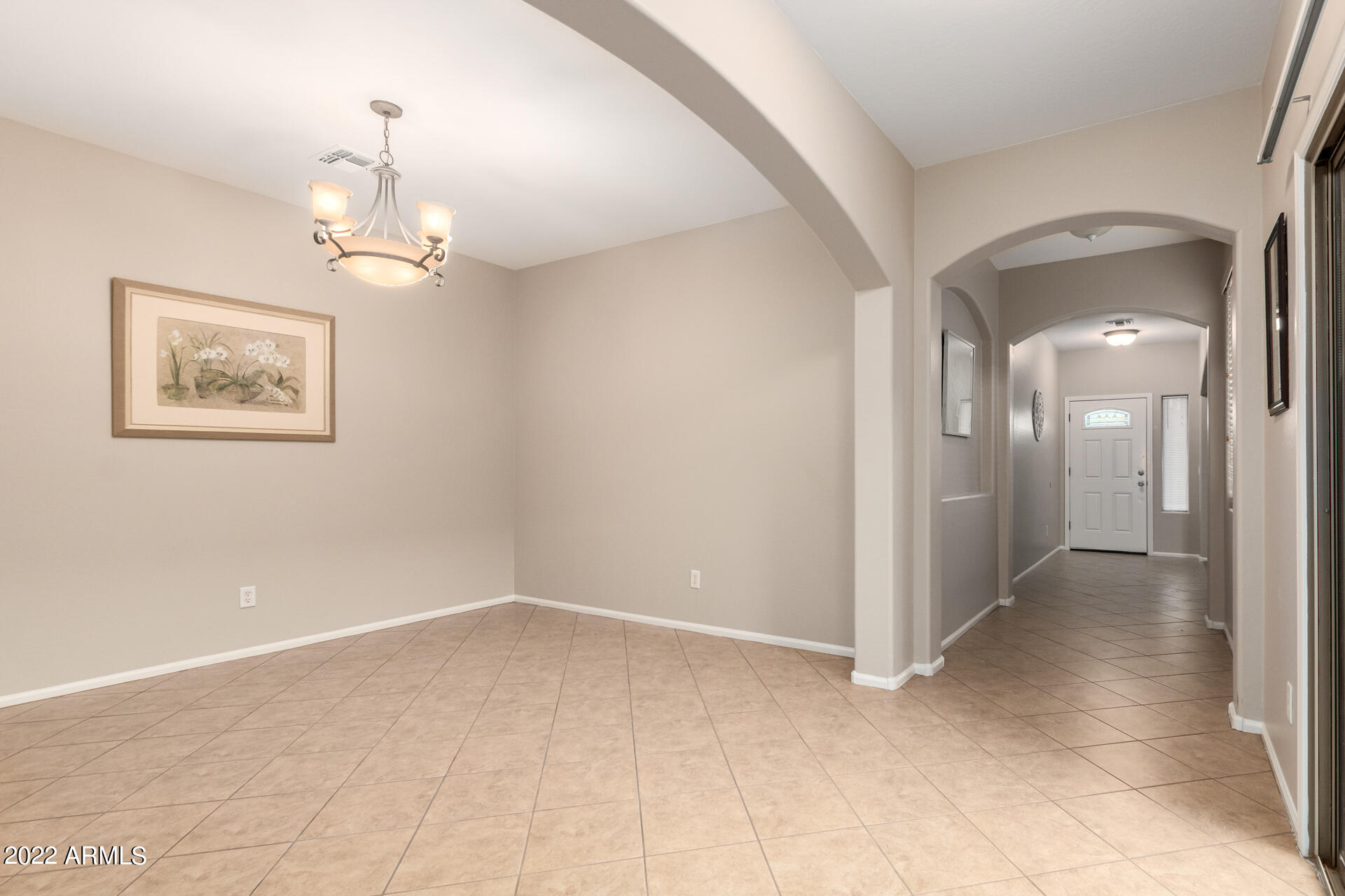 9123 West Heber Road Tolleson, AZ 85353 - Photo 7 of 41 a view of a chandelier fan and entryway