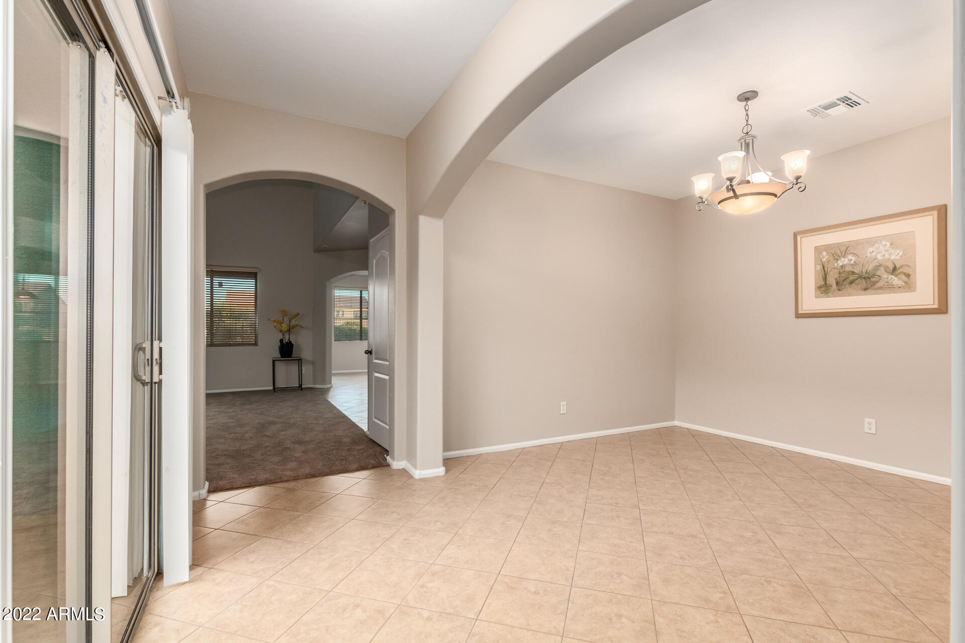 9123 West Heber Road Tolleson, AZ 85353 - Photo 8 of 41 wooden floor in an empty room and a bathroom