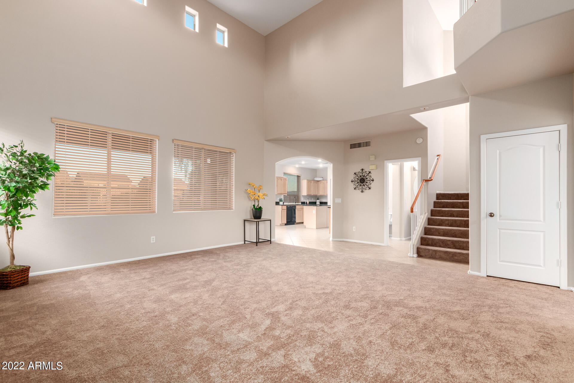 9123 West Heber Road Tolleson, AZ 85353 - Photo 10 of 41 an empty room with furniture and stairs