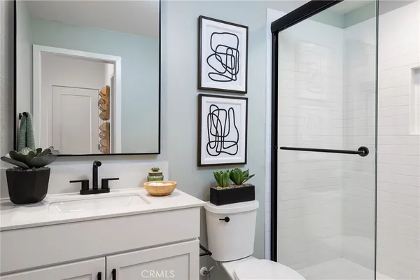 a view of a dining room with furniture one side kitchen view