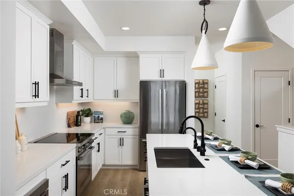 a kitchen with cabinets and appliances