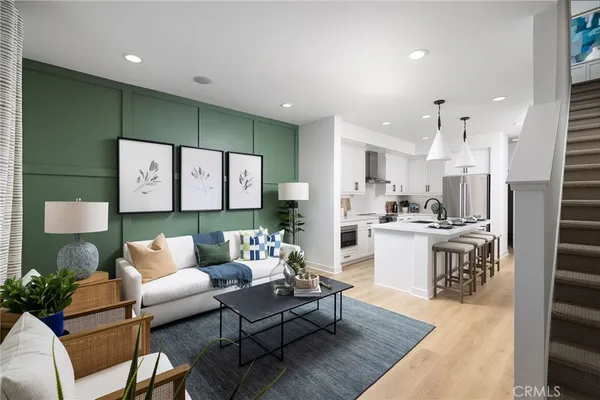 a living room with furniture and white walls