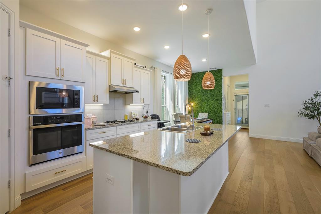 3603 Scotsman Road Sachse, TX 75048 - Photo 10 of 33 a kitchen with a sink stainless steel appliances and cabinets