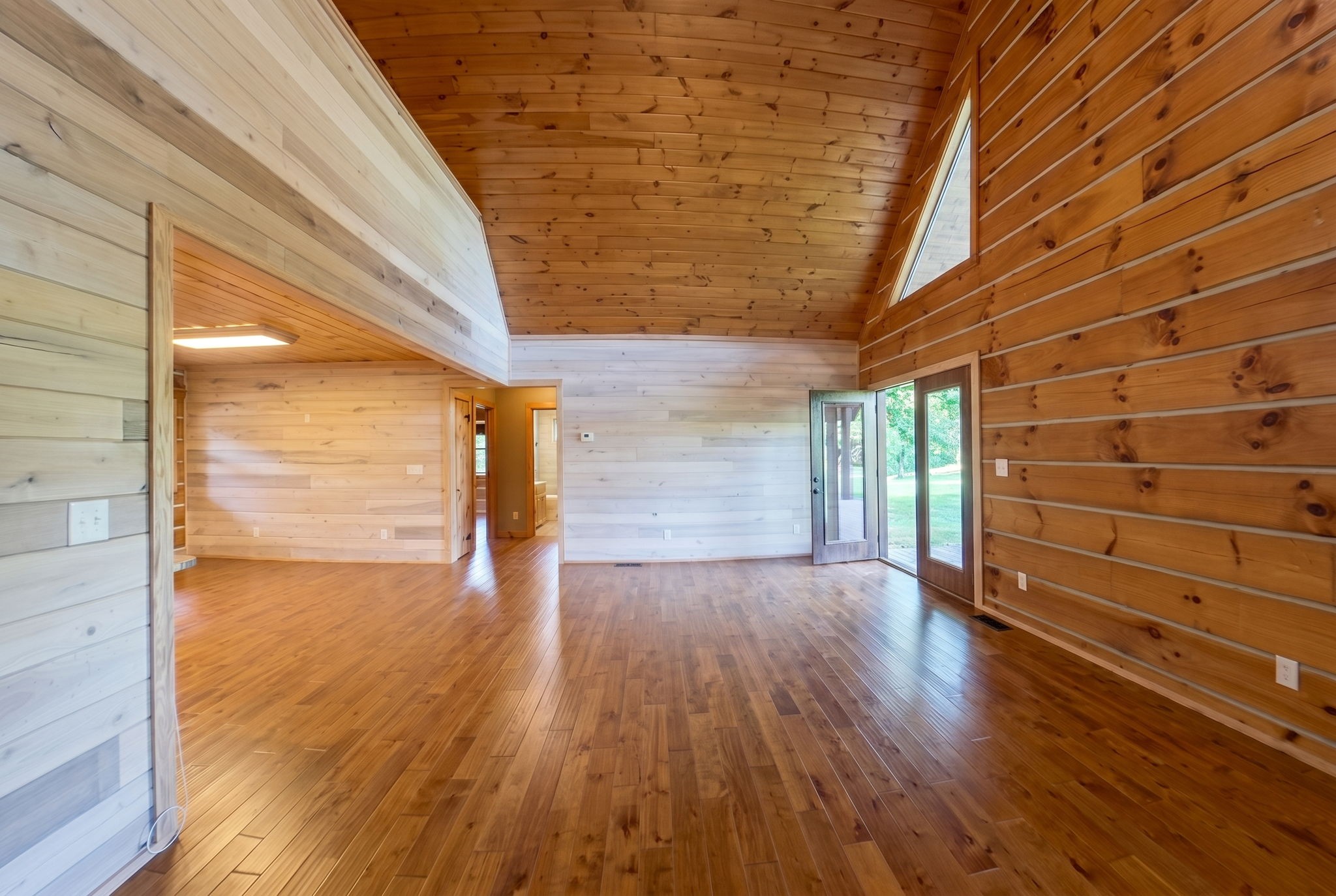 2909 B Beech Log Road Watertown, TN 37184 - Photo 32 of 67 a view of an empty room with wooden floor and a window