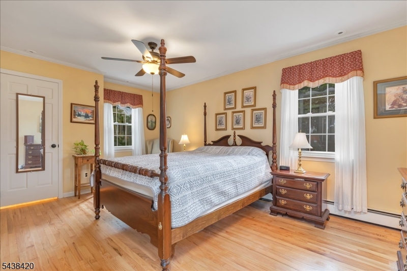 79 Main Street Califon, NJ 07830 - Photo 21 of 50 a bedroom with a bed and wooden floor