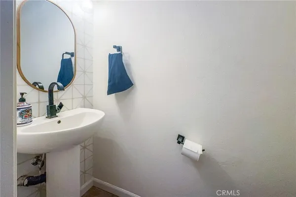 a bathroom with a sink and mirror
