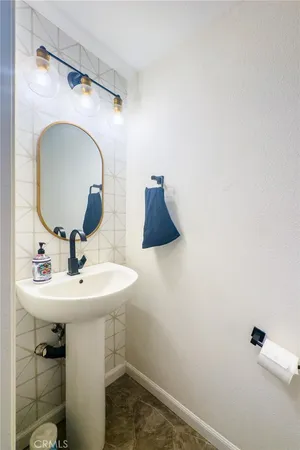 a bathroom with a sink and mirror