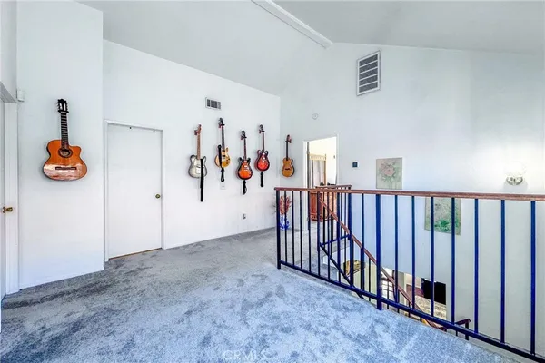 a view of staircase with white walls