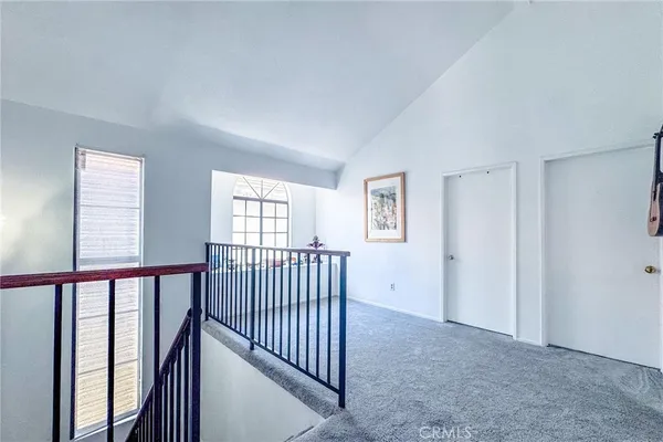 a view of hallway with windows