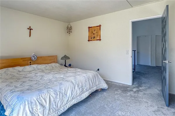 a bedroom with a bed and a cabinets
