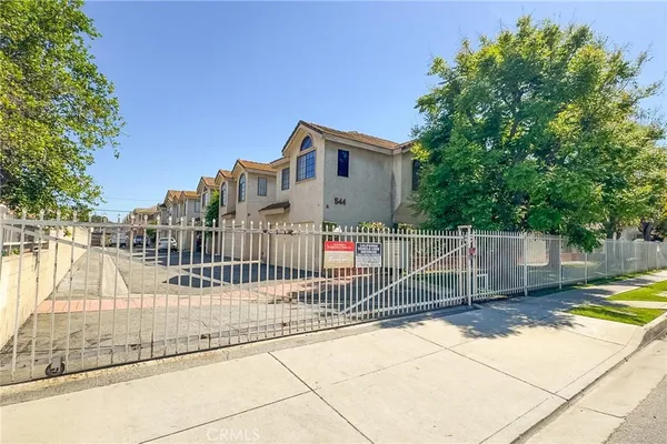 a view of a balcony with small garden