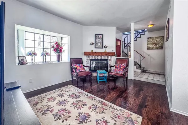 a living room with furniture and a rug