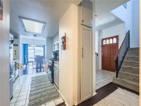 a view of a hallway view with wooden floor and staircase