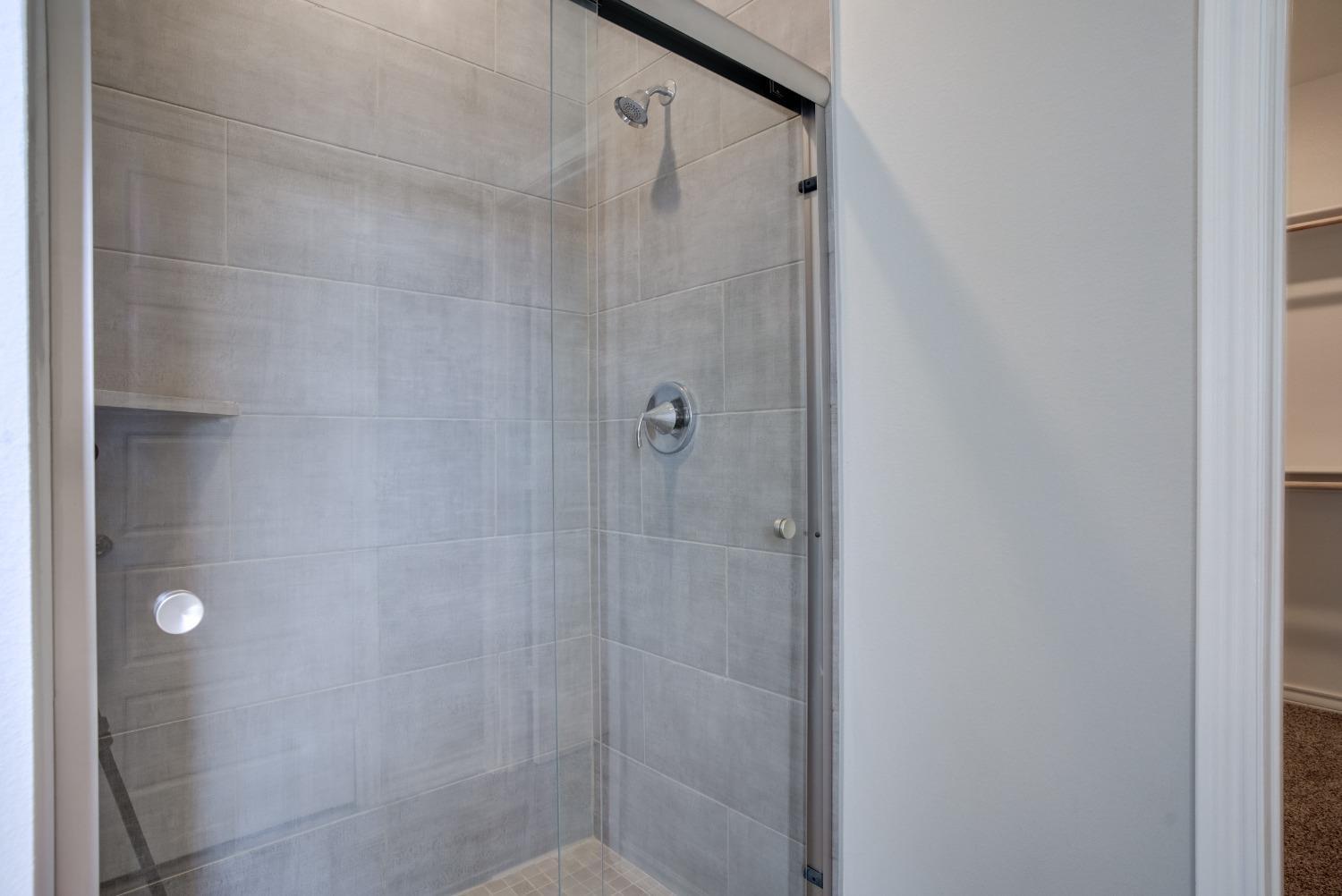 7602 60th Street Lubbock, TX 79407 - Photo 18 of 24 a bathroom with a shower