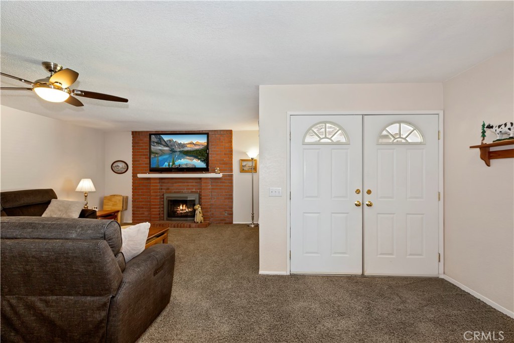 8527 Hillside Road Rancho Cucamonga, CA 91701 - Photo 7 of 50 a living room with furniture and a fireplace