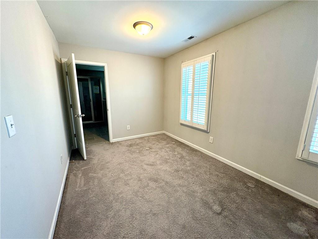 248 Webster Lake Drive Temple, GA 30179 - Photo 15 of 29 an empty room with windows and closet