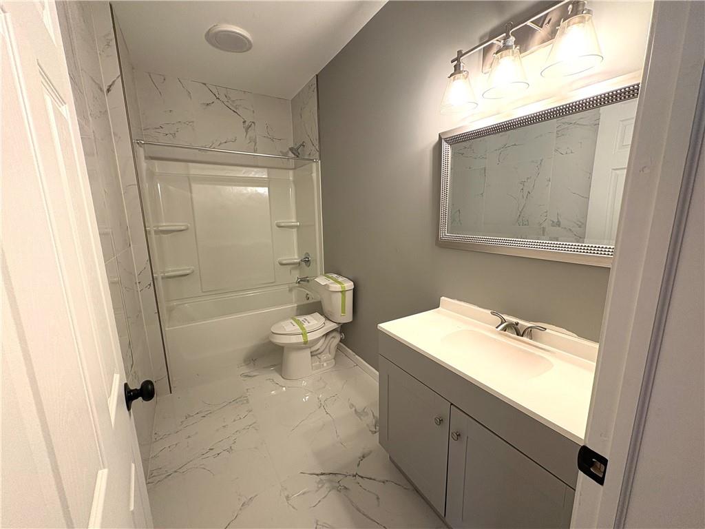 248 Webster Lake Drive Temple, GA 30179 - Photo 24 of 29 a bathroom with a sink a toilet and shower