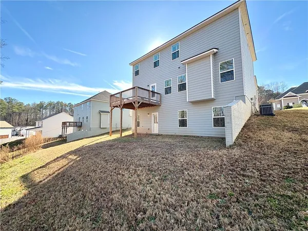 a view of yard with wooden fence