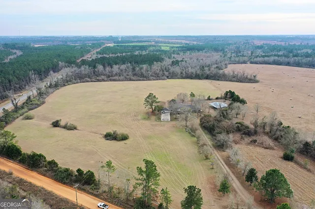 an aerial view of a house with yard