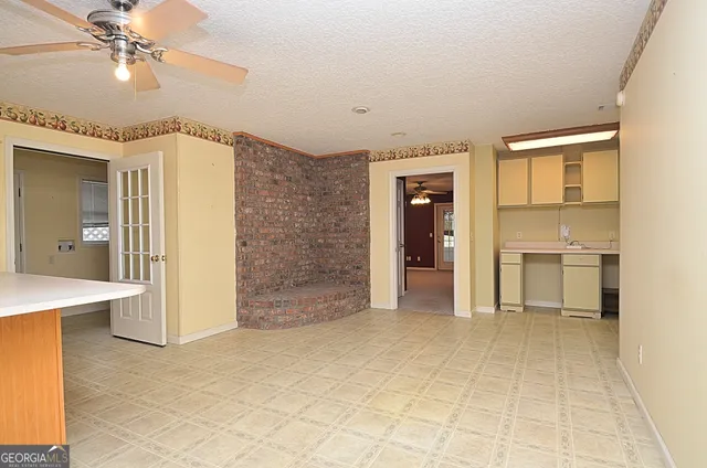 a view of a hallway with a kitchen