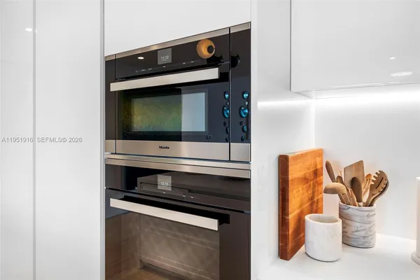 a kitchen with a stove and a microwave