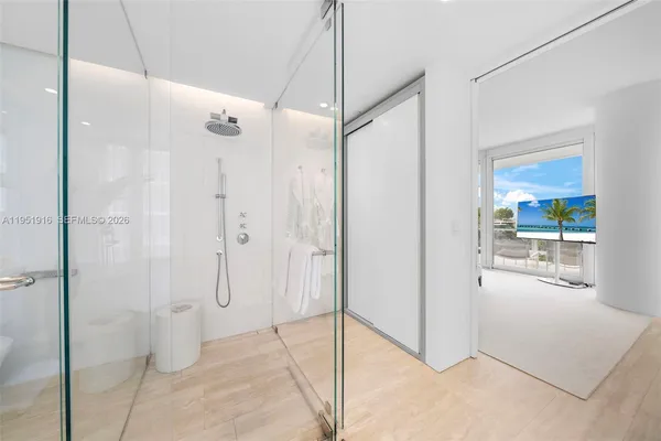 a bathroom with a shower and a sink