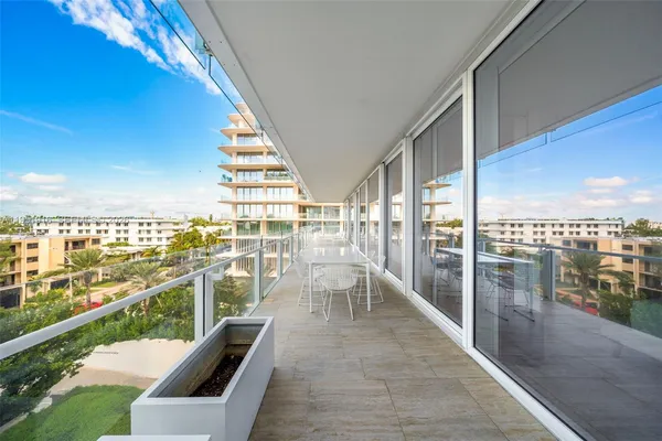 a view of balcony with furniture