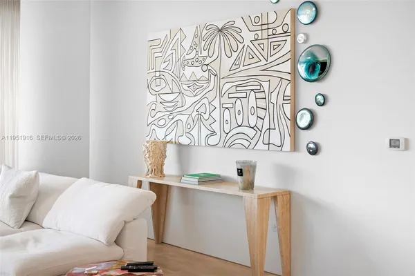 a living room with a couch and a next to a window